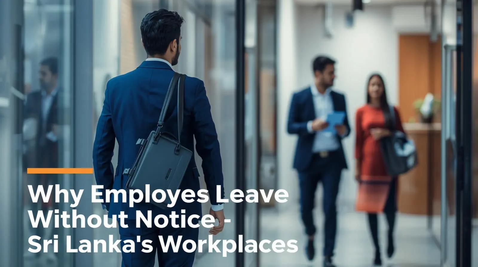 A man in a suit walks through a modern office hallway, with two colleagues in the background engaged in conversation.